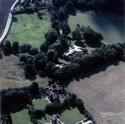 Aerial view. River Bollin snakes through left of image.